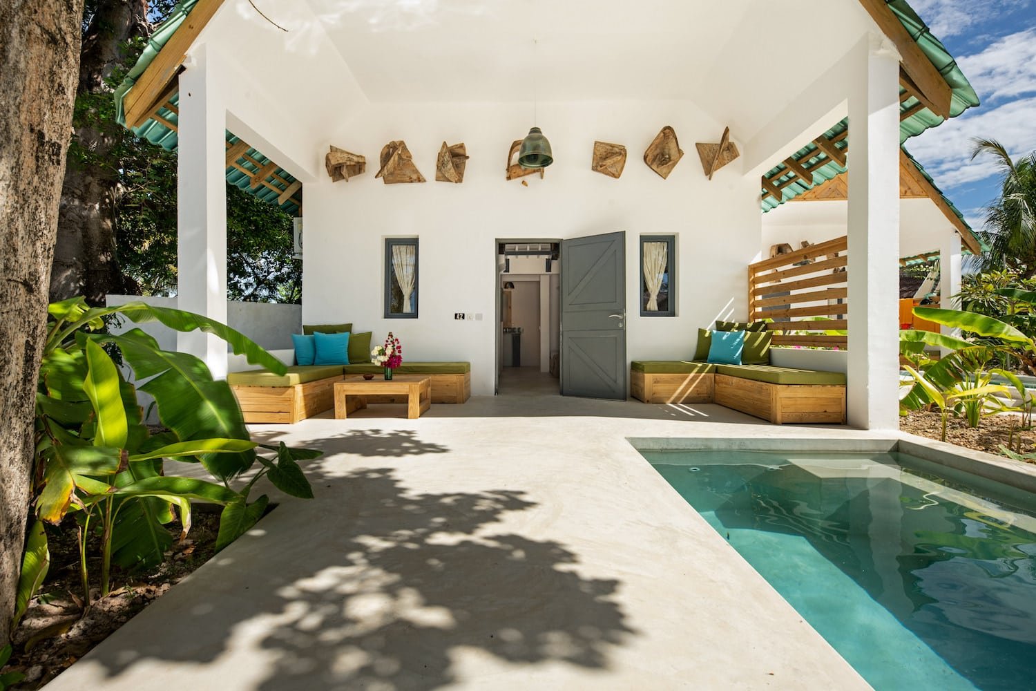 Pool and veranda with couches in Suite Room at Fun Beach Hotel Zanzibar
