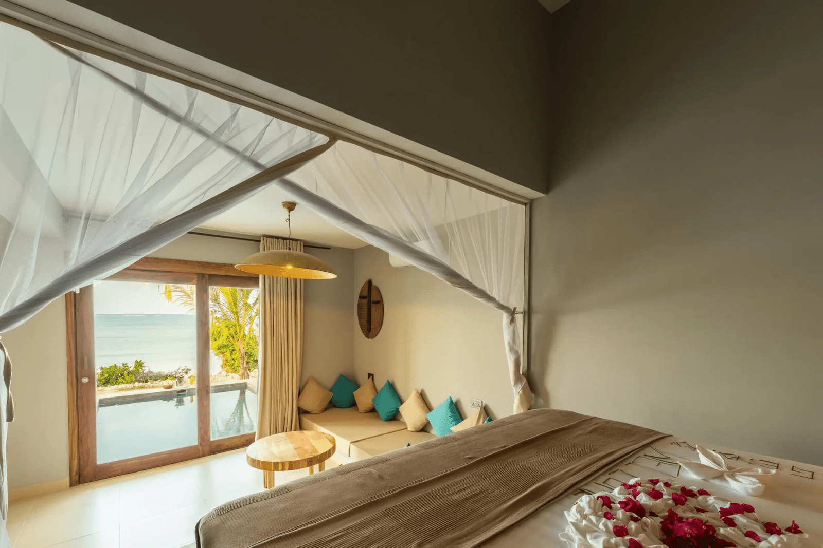 legendary zanzibar beach resort beach front suite bed lounge